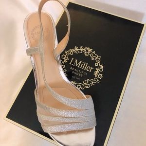 Silver Glittery kitten heel dance shoes.